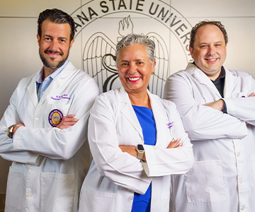 Three doctors stand confidently together. Links to Donor-Advised Funds Three doctors stand confidently together. Links to Donor-Advised Funds