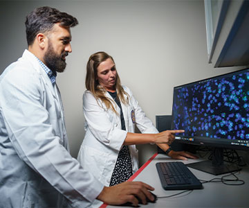 Medical Professionals studying test results on the computer. Links to Beneficiary Designations Medical Professionals studying test results on the computer. Links to Beneficiary Designations